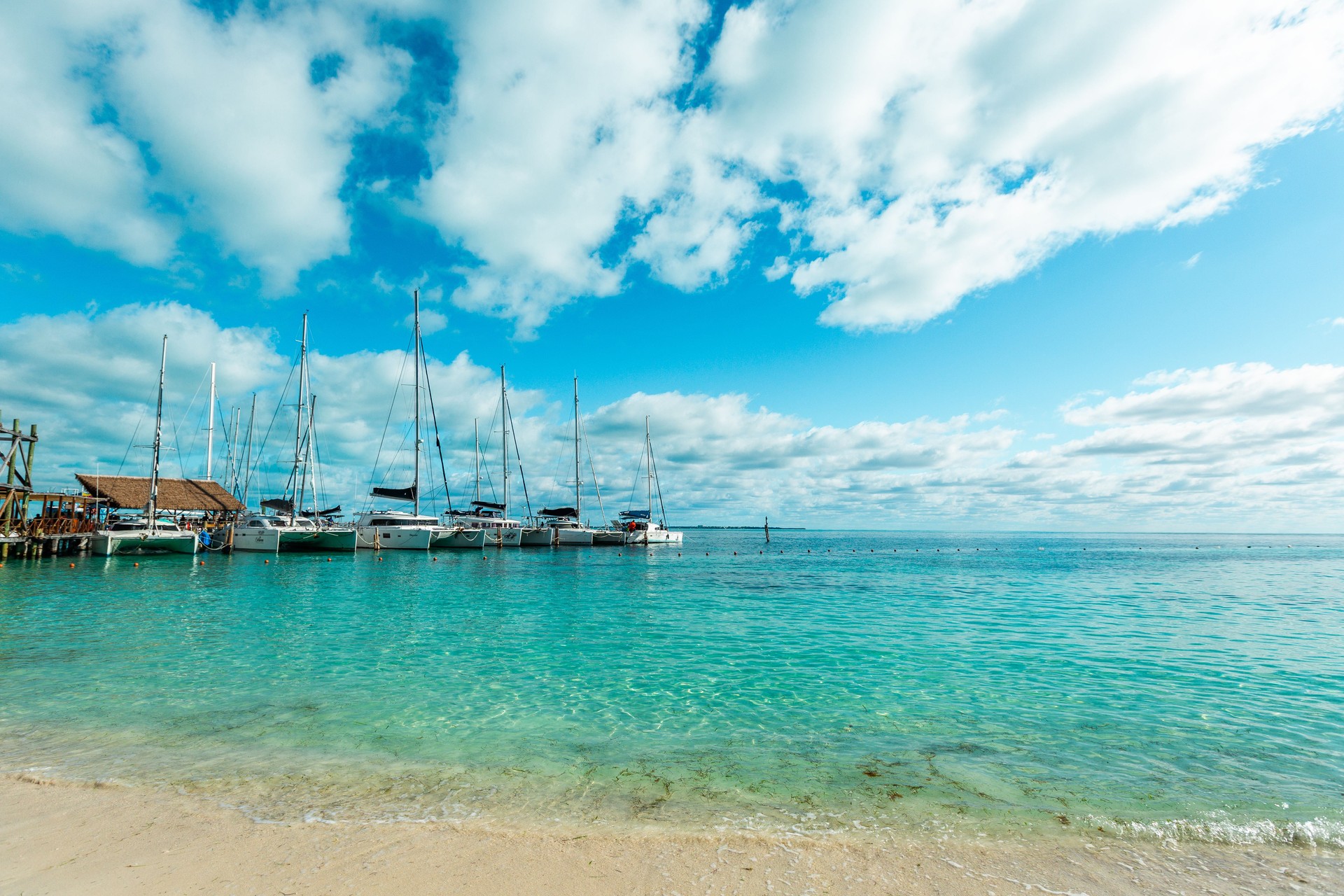 Scenic Playa Tortugas Beach with Marina and Crystal Clear Caribbean Waters in Cancun, Mexico